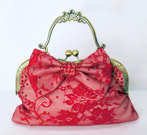 Red lace handbag with bow and antique brass handle, handmade by Rockstars and Royalty