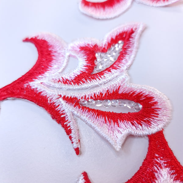 Embroidered red applique with sequins