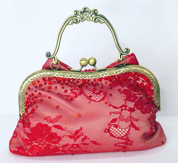 Red lace handbag with bow and antique brass handle, handmade by Rockstars and Royalty