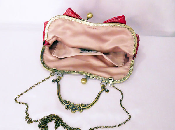 Red lace handbag with bow and antique brass handle, handmade by Rockstars and Royalty