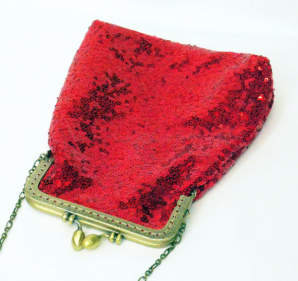 Red sequin pouch bag with brass frame and wrist strap