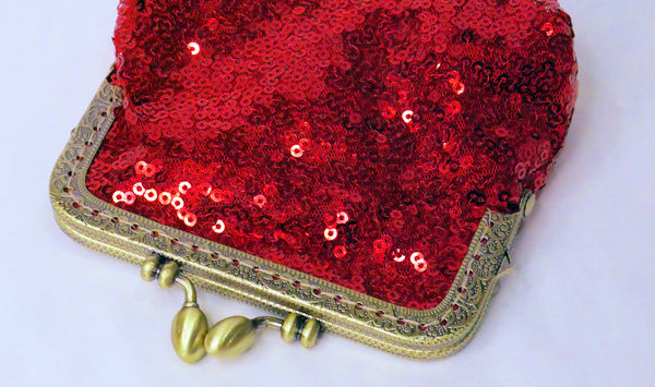 Small red sequin coin purse with brass frame