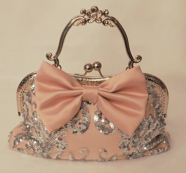 Blush pink satin and silver sequin lace handbag with a bow, silver frame and handle