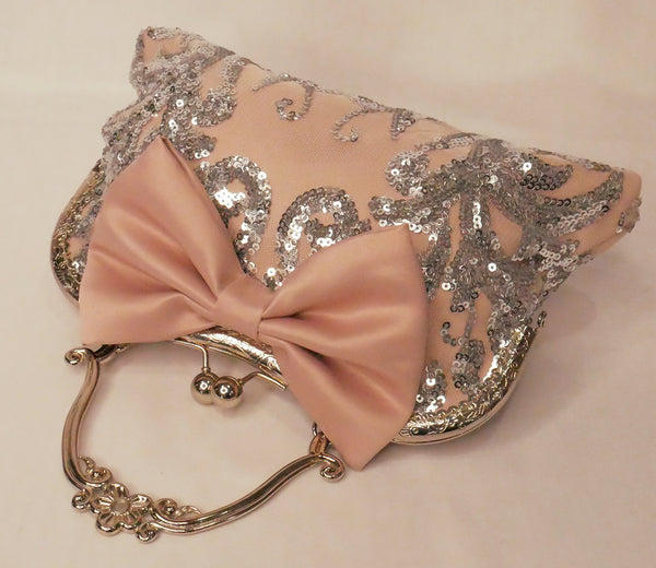 Blush pink satin and silver sequin lace handbag with a bow, silver frame and handle