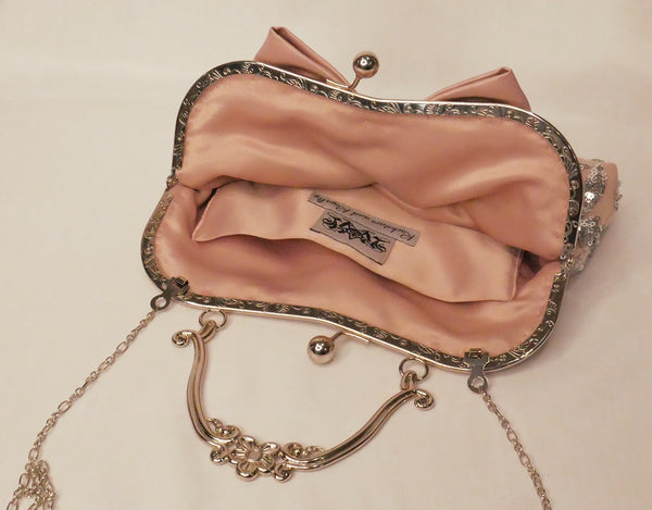 Blush pink satin and silver sequin lace handbag with a bow, silver frame and handle