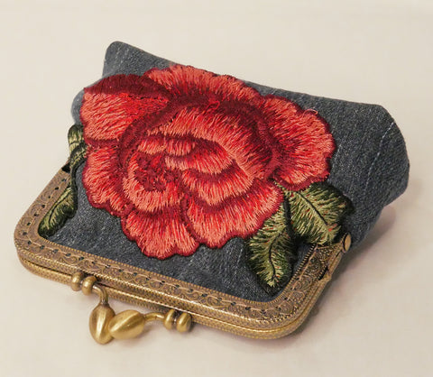 Small denim purse with red rose embroidered applique and antique brass frame