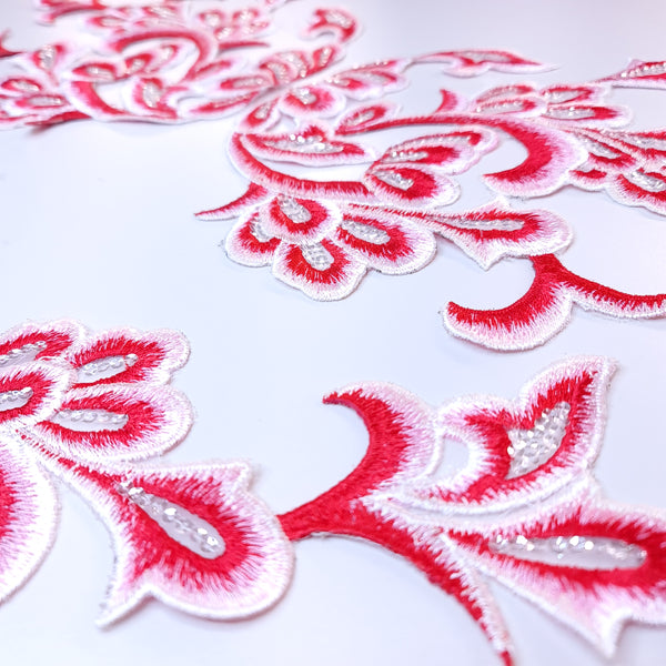 Embroidered red applique with sequins