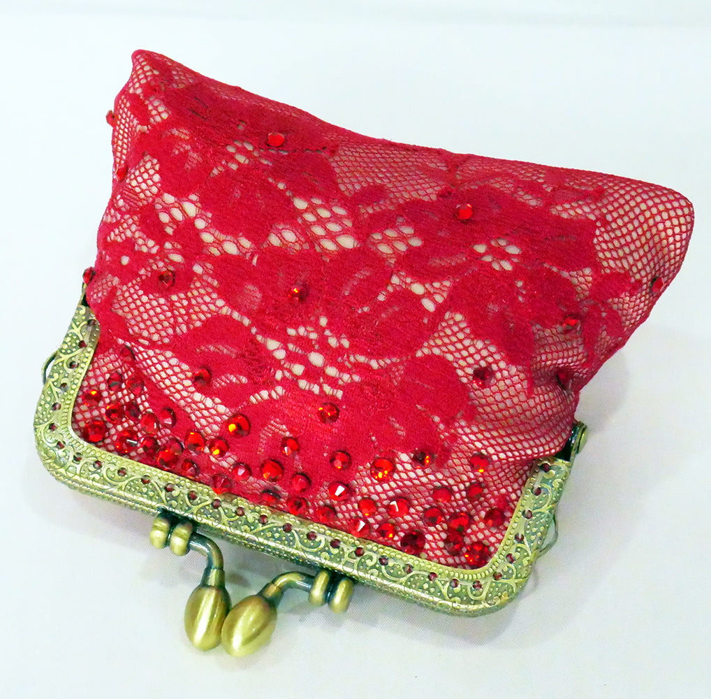 Red lace coin purse with brass frame and red crystals