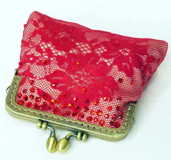 Red lace coin purse with brass frame and red crystals