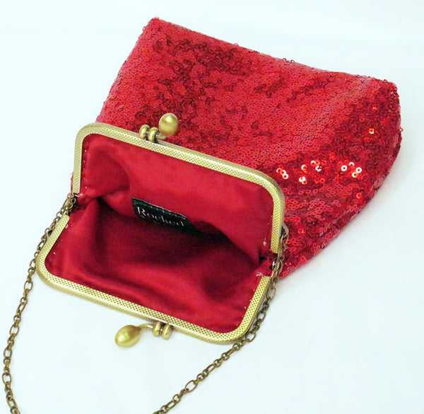 Red sequin pouch bag with brass frame and wrist strap