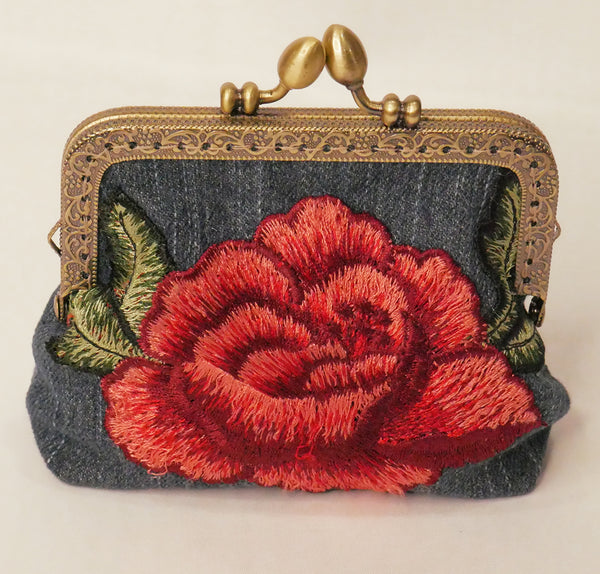 Small denim purse with red rose embroidered applique and antique brass frame